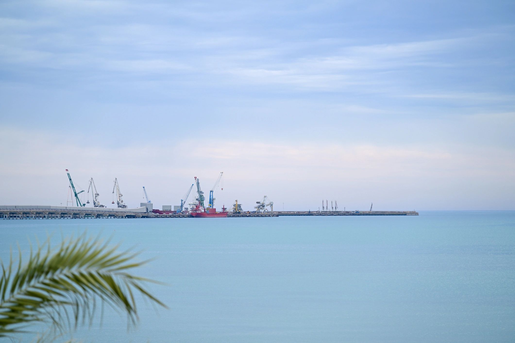 Cargo terminal with ships and cranes at an industrial port